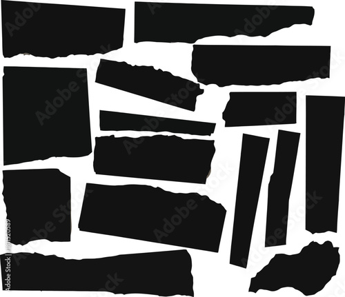 Collection of torn black paper scraps and strips on white background