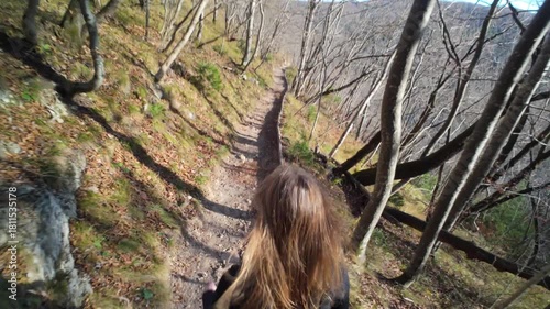 Woman hiking Plitvicka Jezera Croatia travel destination scenic lakes waterfalls nature park landscape outdoor adventure tourism national park Unesco heritage