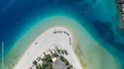 Fototapeta Naklejka Na Ścianę i Meble -  Aerial summer travel scene showing Ölüdeniz Blue Lagoon’s vivid turquoise sea