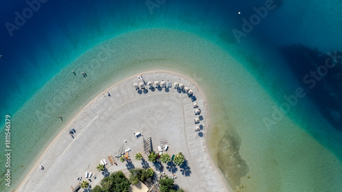 Fototapeta Naklejka Na Ścianę i Meble -  Aerial summer travel scene showing Ölüdeniz Blue Lagoon’s vivid turquoise sea