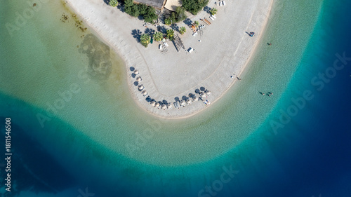 Fototapeta Naklejka Na Ścianę i Meble -  Aerial summer travel scene showing Ölüdeniz Blue Lagoon’s vivid turquoise sea