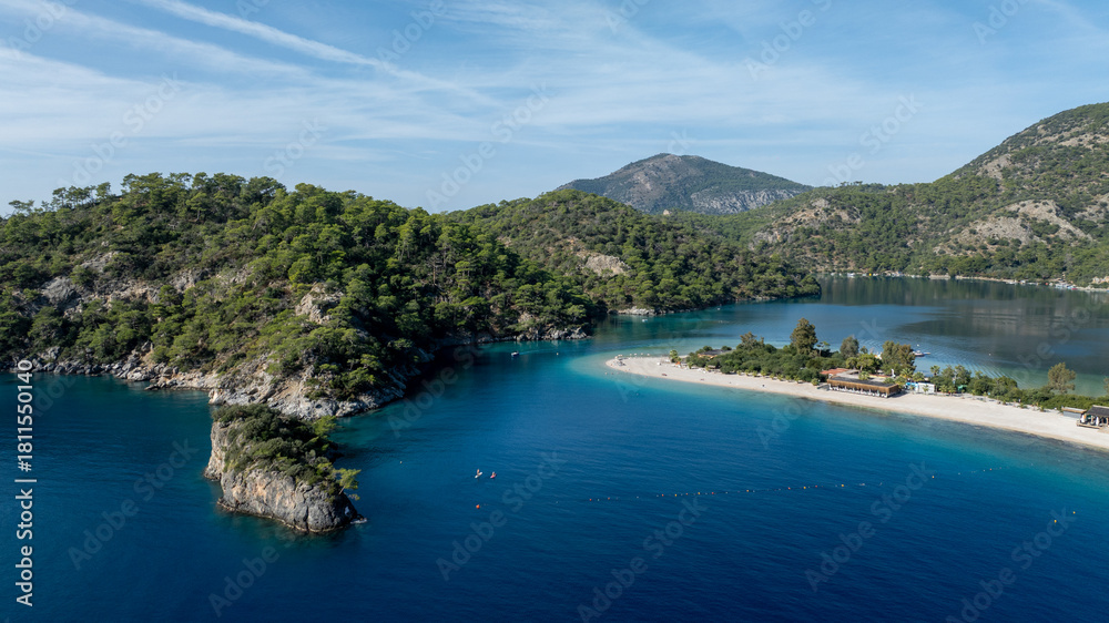 Fototapeta premium High-angle summer view of Ölüdeniz with its curved beach and crystal-clear waters.