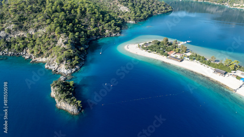 Fototapeta Naklejka Na Ścianę i Meble -  Scenic aerial footage capturing the bright blue lagoon and surrounding natural beauty.