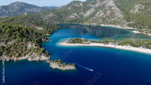 Fototapeta Naklejka Na Ścianę i Meble -  Scenic aerial footage capturing the bright blue lagoon and surrounding natural beauty.