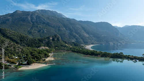 Fototapeta Naklejka Na Ścianę i Meble -  Aerial view of Ölüdeniz Blue Lagoon showing its iconic turquoise waters and summer coastline