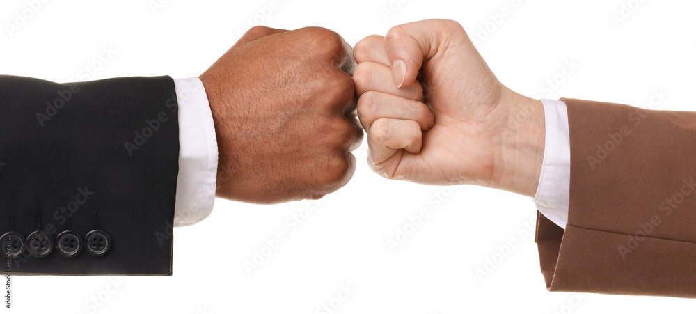 Obraz premium African American man bumping fists with his business partner on white background, closeup