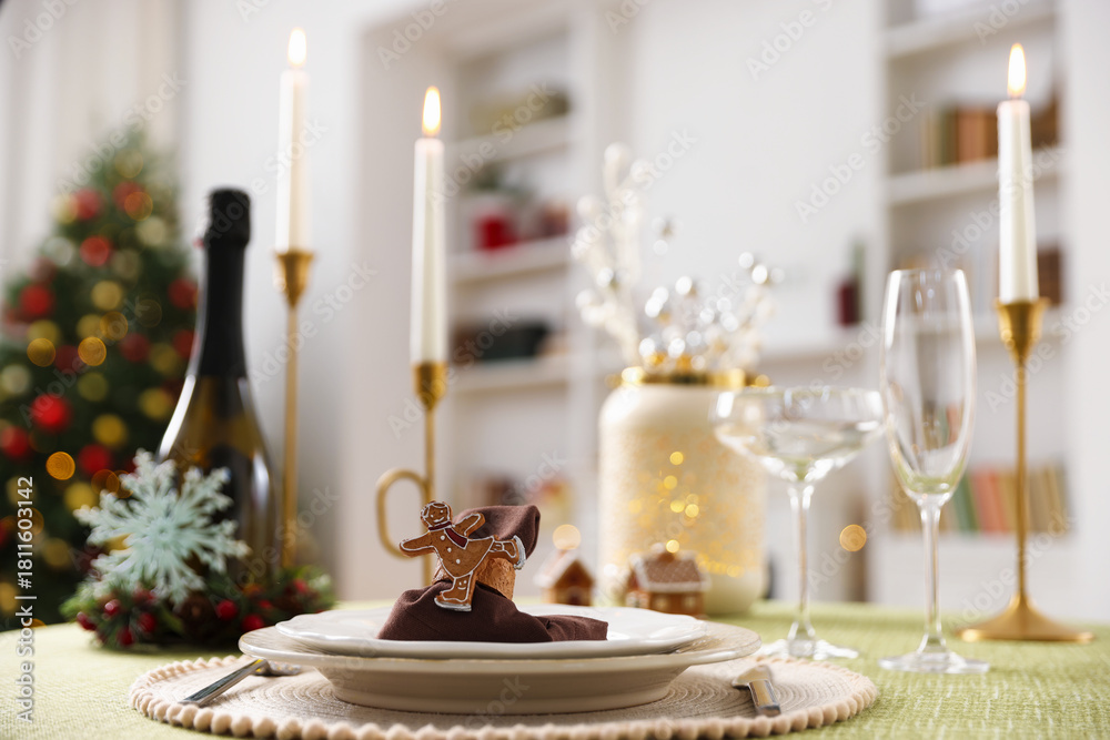 Fototapeta premium Festive table setting with Christmas decor and burning candles indoors, closeup