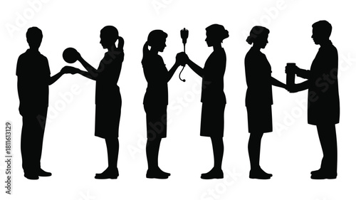 Medical personnel exchanging items in set