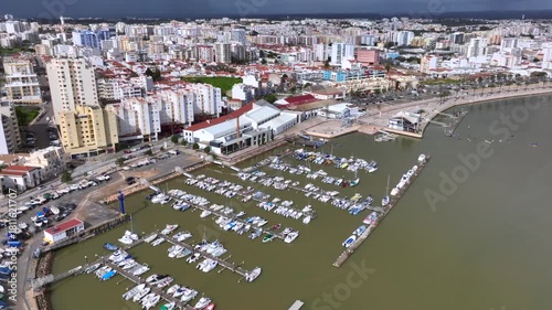 Aerial Drone Shot of City of Portimao, Portugal on Algarve coast. Summer in Europe near the Ocean, Vacation Destination