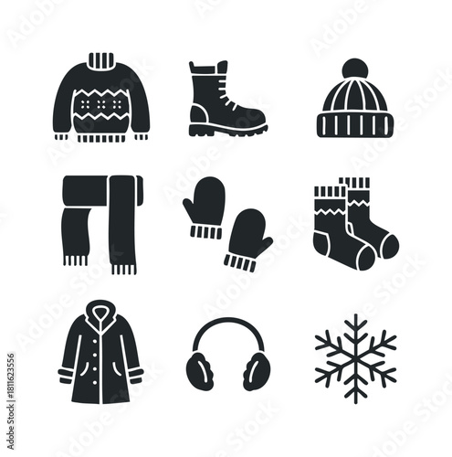 Comprehensive collection of essential black glyph icons representing various winter clothing items and a snowflake, perfect for seasonthemed graphic projects and holiday advertisements