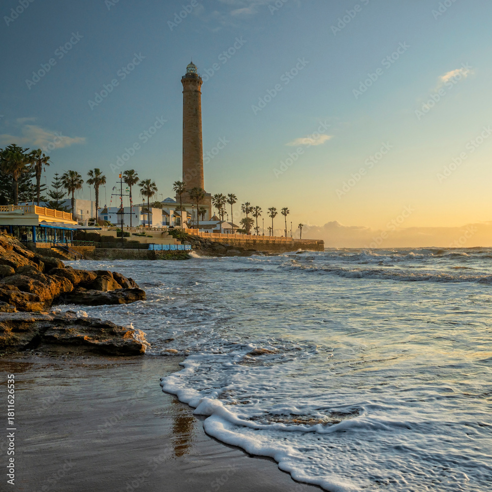 Fototapeta premium Chipiona, Spain. Chipiona Lighthouse on the Ocean Shore. Sea travel and tourism, Atlantic 