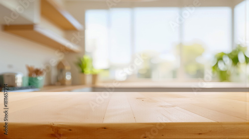 明るくぼやけたモダンなキッチンの背景にある空の木製テーブルトップ