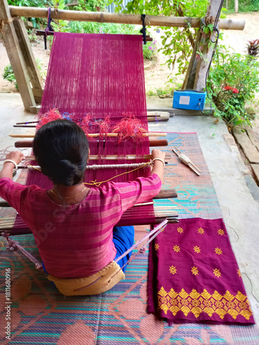 Handloom weaver in India working in her loom.
