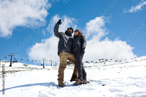Happy Couple Taking Selfie in Snow – Winter Travel Lifestyle