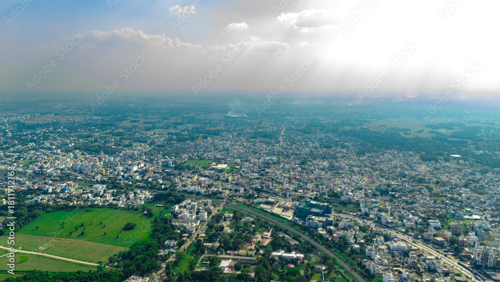 Obraz premium Top down Buildings and Apartment with Multiple Building aerial. Urban Buildings and Apartment at bridge road at Delhi. Cinematic cityscape drone shot. Noida Buildings.