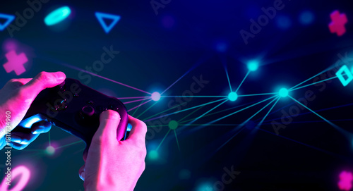gamer hand touching and interactive to holographic of gaming joystick controller, game and esports technology