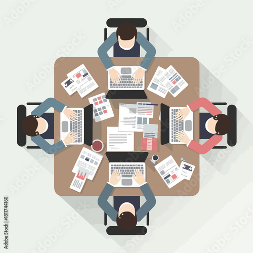 Top view of business people working on laptops and documents at office table creative team collaborating on project in modern workspace
