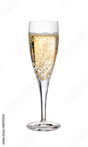 Canvas-taulu A glass of champagne, fizzy wine, as a birthday celebration or to celebrate the New Year with some fizzy bubbles on the top in a cut crystal glass, flute, isolated against a transparent background