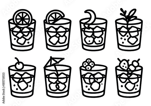 Variety of cocktails with fruit garnishes in iconic glass designs