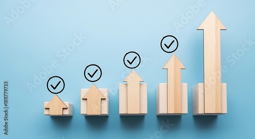 Wooden arrows on blue background showing business growth and success
