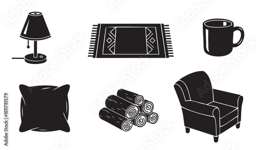 Collection of black silhouette icons representing cozy home decor and comfort, featuring a lamp, armchair, rug, pillow, firewood, and a mug for a warm and relaxing lifestyle