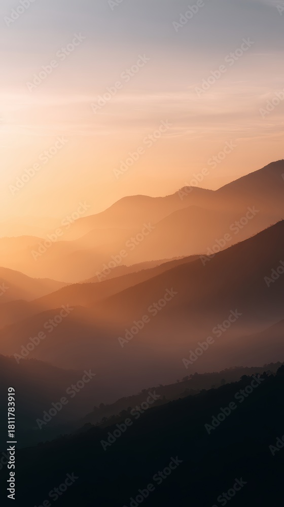 Obraz premium mountain landscape with sunrise and misty valleys, close-up shot, warm earthy hues, premium look, natural daylight, ample space for text, brand-safe, no logos