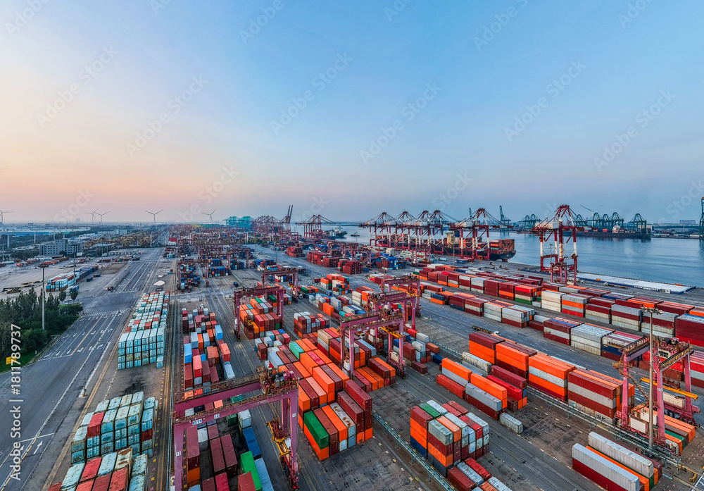 Obraz premium Aerial view of the cargo terminal of Tianjin Port at dusk
