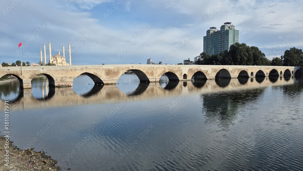 Fototapeta premium Ancient Roman stone bridge over Seyhan River in Adana, Turkey