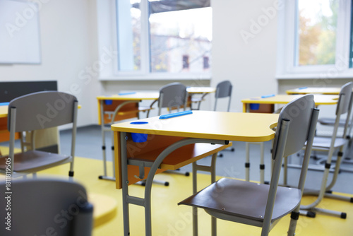 Wallpaper Mural Stylish classroom with desks and chairs at school, closeup Torontodigital.ca