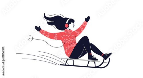 Joyful young woman wearing headphones and warm winter clothes rapidly sledding down a snowy hill enjoying a fun winter activity.