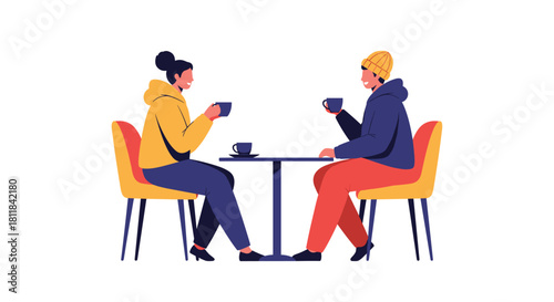 Happy young couple sitting comfortably at a cafe table enjoying hot coffee and engaging in a pleasant and intimate conversation.