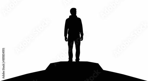 Silhouette of a Man Standing on a Hilltop.
