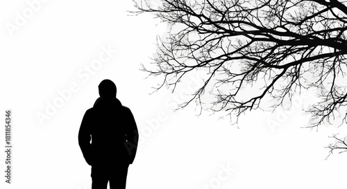 Dark silhouette of a solitary person standing alone.