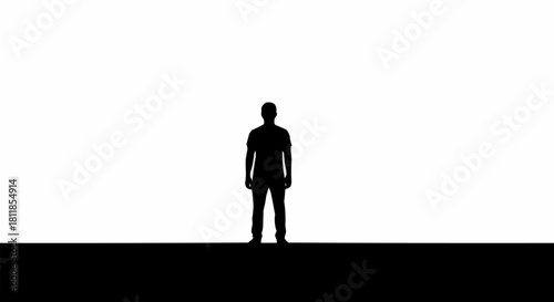 Silhouette of a person standing alone against a bright background.