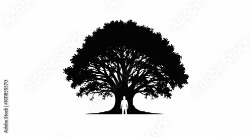 Silhouette of a person standing beneath a large, majestic oak tree.