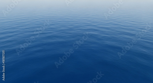 Tranquil blue ocean water surface texture with gentle ripples, peaceful