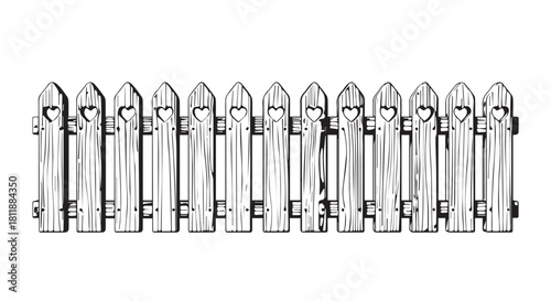 Charming row of wooden picket fence posts along a garden boundary and pathway.