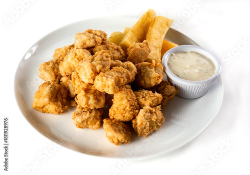 Peruvian food: chicharron de pescado or fish cracklings. White background