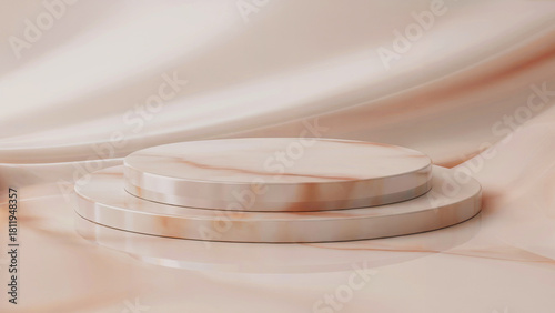 An elegant marble podium of two round tiers against a background of flowing beige fabric. Ideal for the presentation of premium products - combines luxury and minimalism.