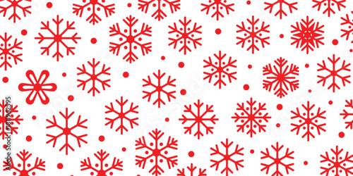 Red snowflakes and dots pattern on a pure white background