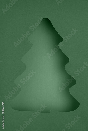 Stylized Christmas Tree Cutout on Layered Green Paper
