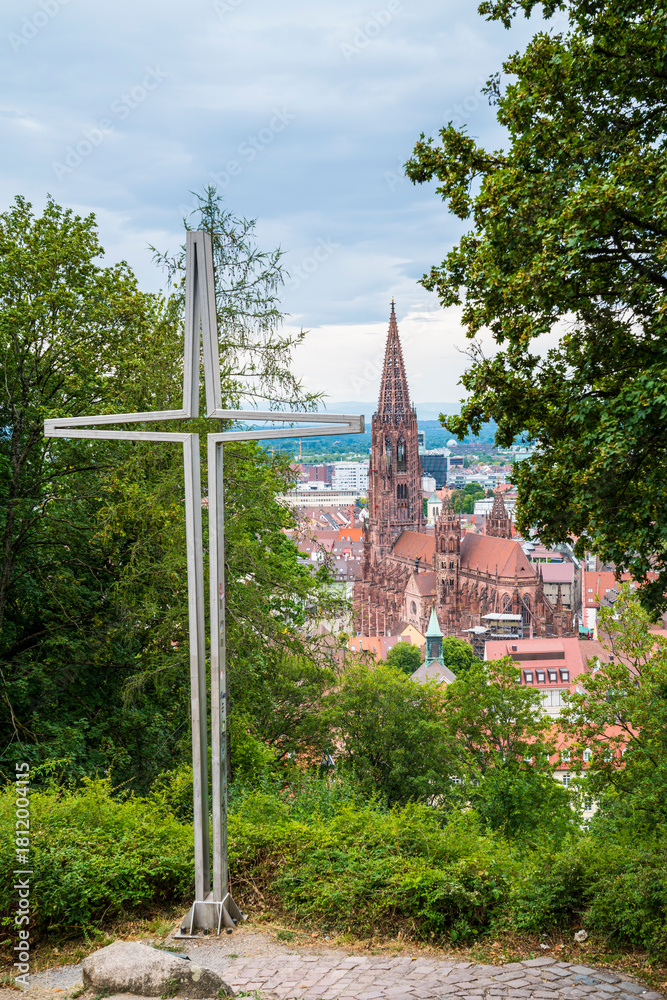 Fototapeta premium Germany, Aerial panorama view of freiburg im breisgau city minster cathedral in historical old town next to cross