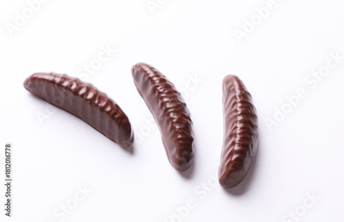 Принти на полотні Chocolate candies on white background. Top view