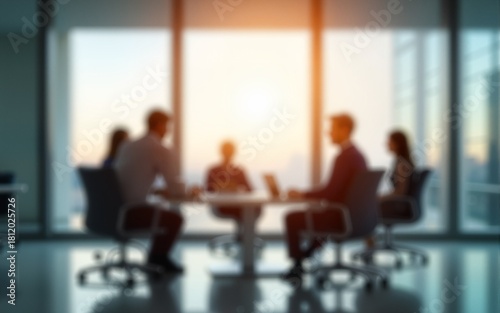 Defocused abstract background featuring a modern meeting room with natural light and a professional team collaborating. Ideal for business and corporate visuals. High quality