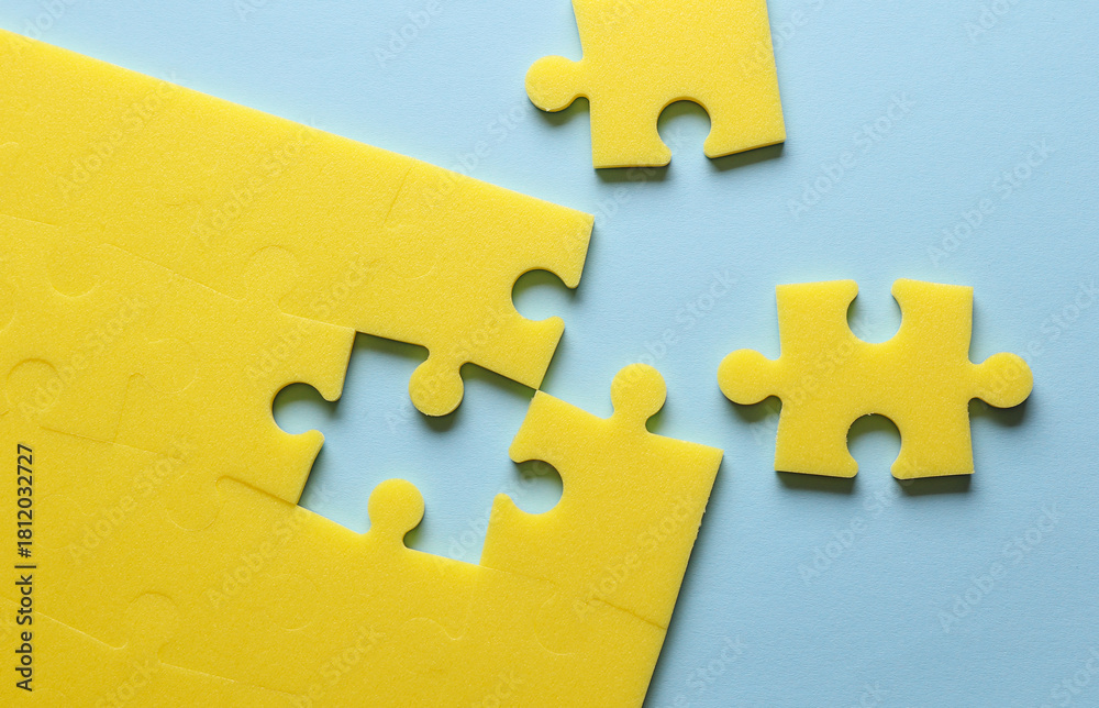 Fototapeta premium Yellow puzzle pieces. Teamwork, business concept