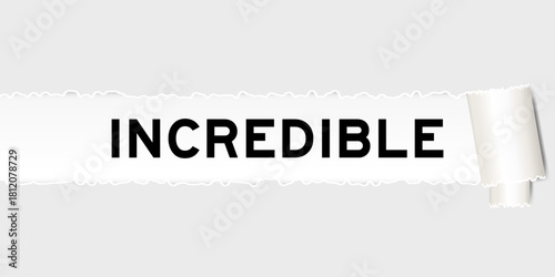Ripped gray paper background that have word incredible under torn part