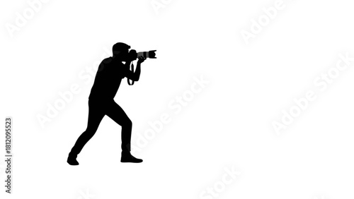 Black Silhouette of Photographer Holding DSLR Camera in Dynamic Standing Pose with Soft Artistic Backdrop.svg
