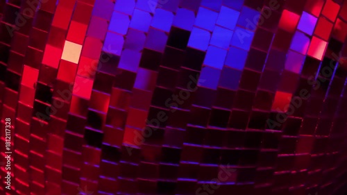 This captivating photo of a disco ball illuminated with colorful lights enhances the dance floor vibes, inviting a celebration of music, movement, and connection.