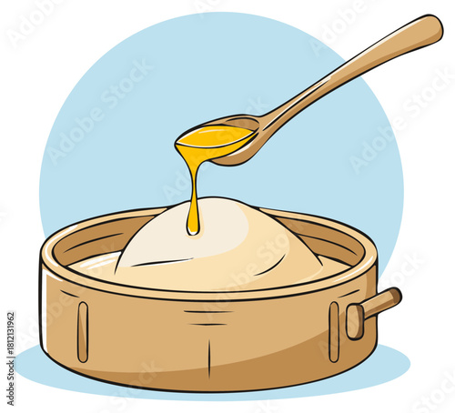 Wooden spoon pouring golden liquid onto a creamy food dish in a rustic bowl cooking preparation