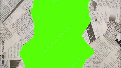 Close up shot of torn newspaper pieces with green screen elements overlayed